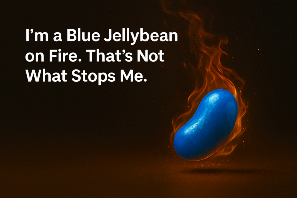 Image of a blue jellybean surrounded by flames on a dark background with white text that reads, “I’m a Blue Jellybean on Fire. That’s Not What Stops Me.” — representing life with FND.